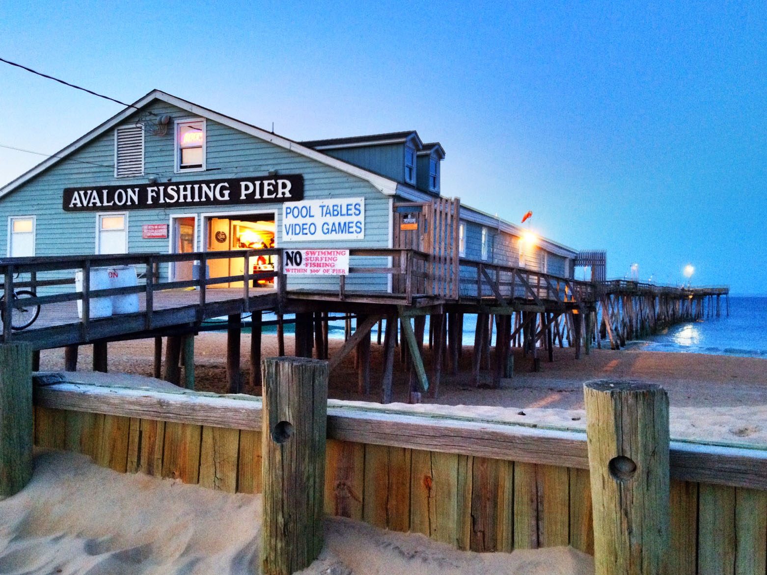 The Avalon Fishing Pier at dusk in Nags Head, North Carolina